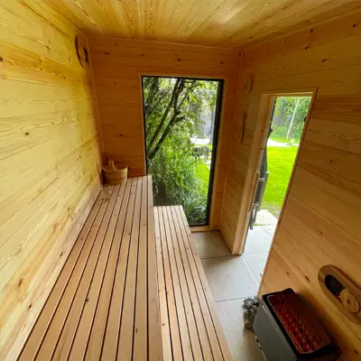 Timbersource's Scandinavian Redwood Pine Cladding on the walls of a sauna
