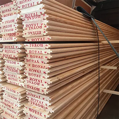 A stack of Redwood Pine machined to a Tongue, Groove pattern with a V groove and Bead
