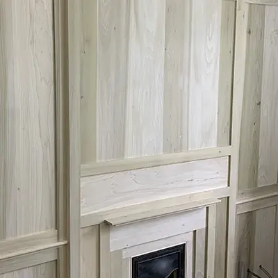 American Poplar Tulipwood panelling around a fireplace