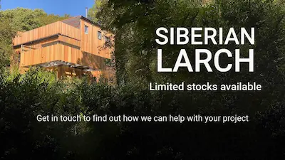 Siberian Larch Banner A large peoperty nestled in a forest with Siberian Larch Cladding all over, with Timbersource explaining that there are limited stock available