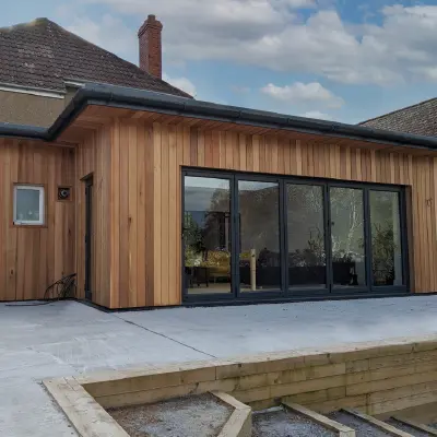 Timbersource's Canadian Western Red Cedar 45 Degree Halflap Cladding on the side of a building