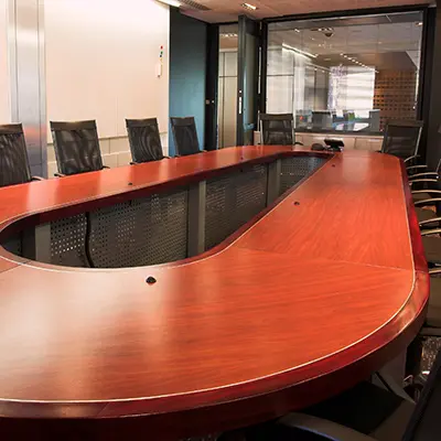 A large boardroom table made of American Cherry
