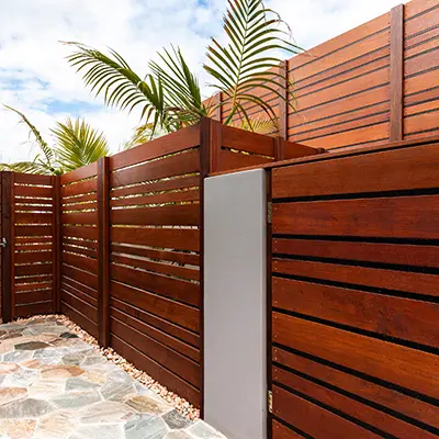 A garden with Timbersource's West African Sapele Cladding