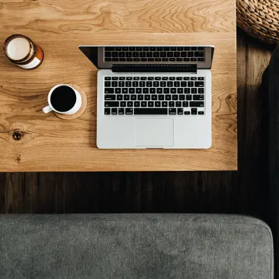 Oak Desk with laptop and cup of coffee on
